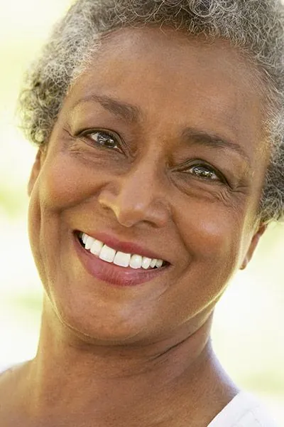 woman with all-on-4 dental implants smiling