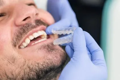 patient getting fitted for Invisalign clear aligners at Hymas Family Dental in Spokane Valley, WA
