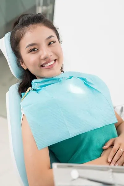 new patient smiling during her visit at Hymas Family Dental