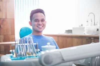 patient smiling during his periodontal appointment at Hymas Family Dental