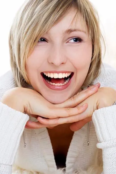 woman smiling after her mouth is restored