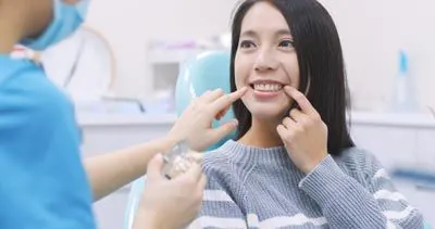woman explaining her dental concerns to her dentist